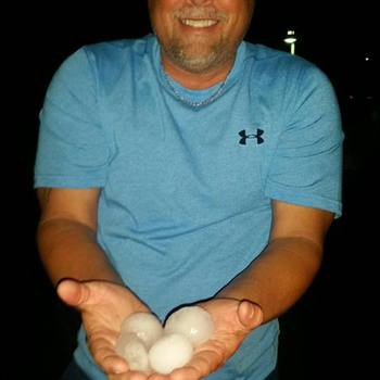 Owner Andy Dumas showing us hailstones from a recent storm