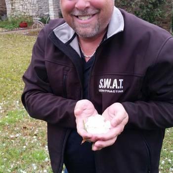 Andy Dumas (owner) checking out the hail