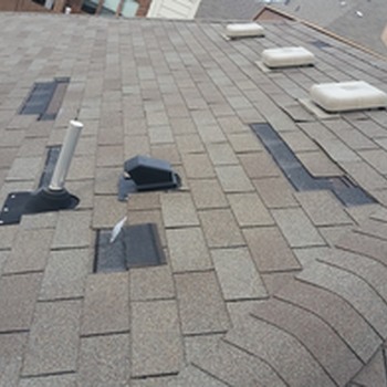 Missing roof shingles due to wind damage