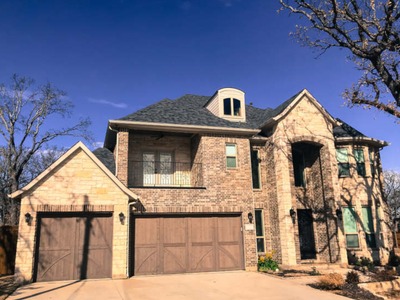 two story house where the entrance goes all the way up to the roof and is pointed