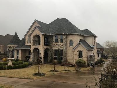 home with a driveway that is extra long and goes along the side of the two story house