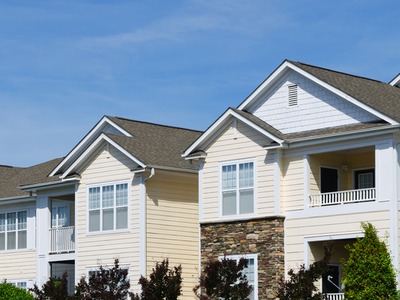 top half of white apartment buildings taken from outside