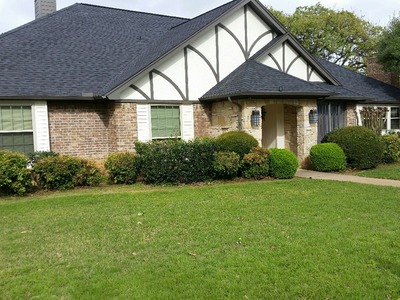 house picture taken from the green lawn outside